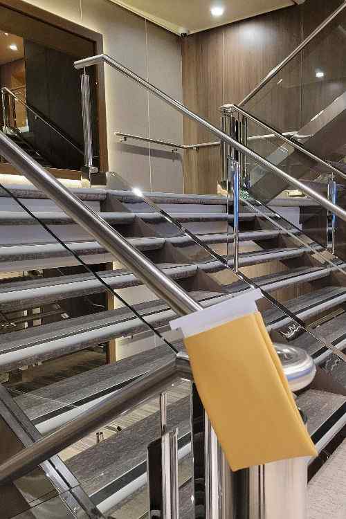 Barf bags hung on a staircase