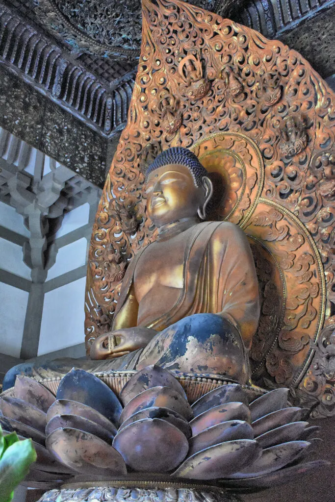 The Amida Buddha sitting on a lotus leaf