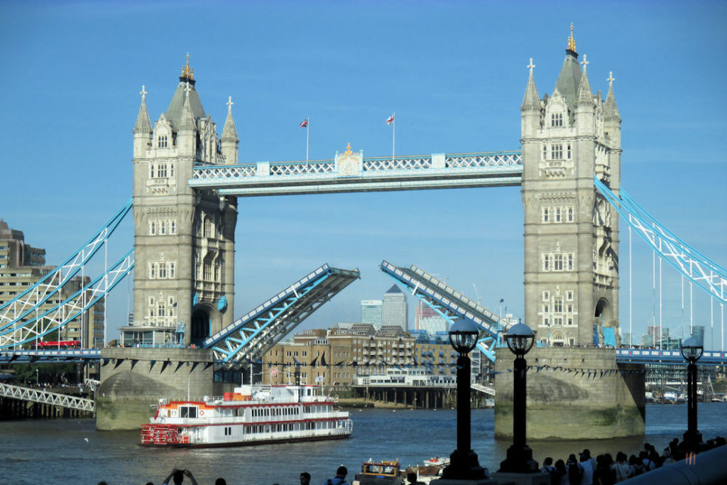 London's Tower Bridge opening to allow a ship to sail beneath it