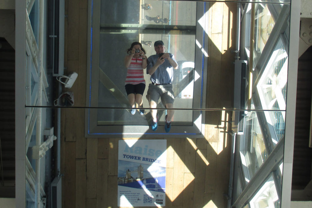 Doing our selfies on the glass floor while the traffic and people travel beneath us