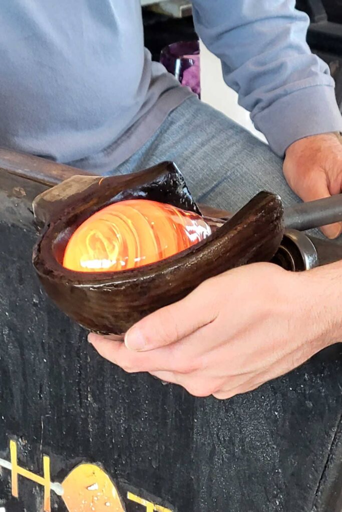 Shaping the glass in the hot glass studio