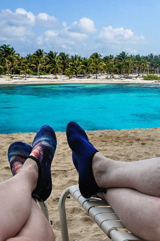 Wearing our water shoes in the Caribbean