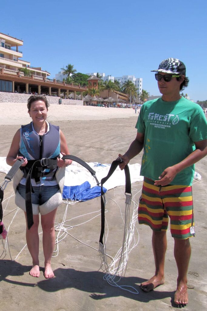 Harnessed for parasailing from the beach