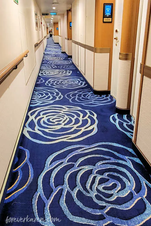 Majestic Princess blue carpeted floor on the port side