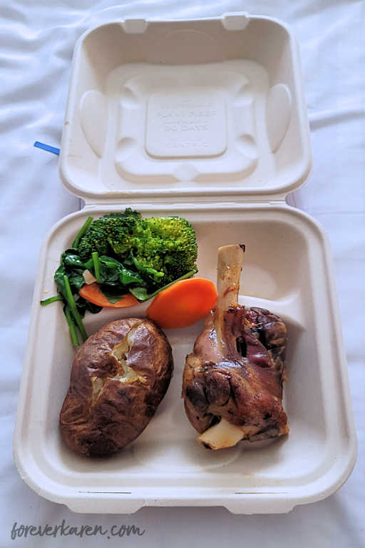 A cruise ship Covid meal in a paper container