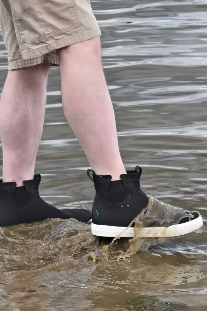 Wearing Weekender Chelsea waterproof boots in the muddy river