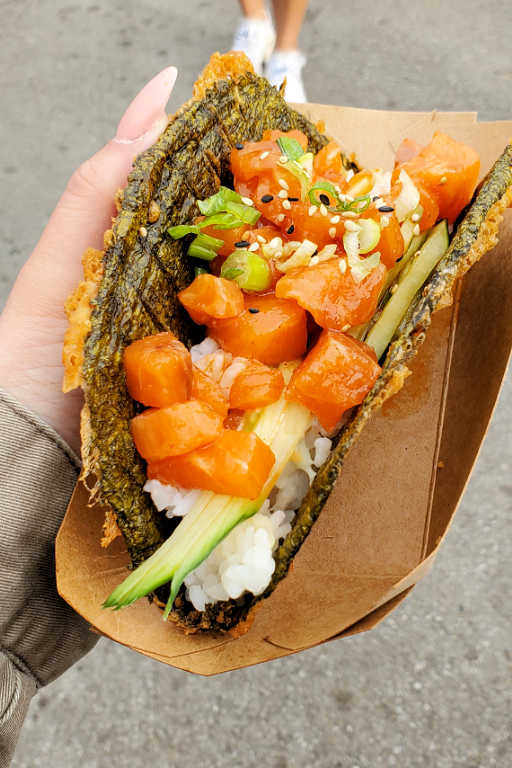 Spicy salmon sushi taco with rice and cucumber
