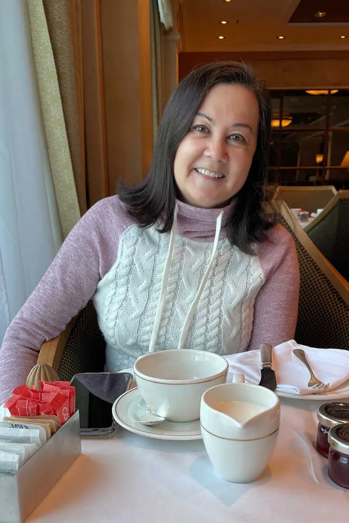 Dressed in a sweater for Cunard afternoon tea