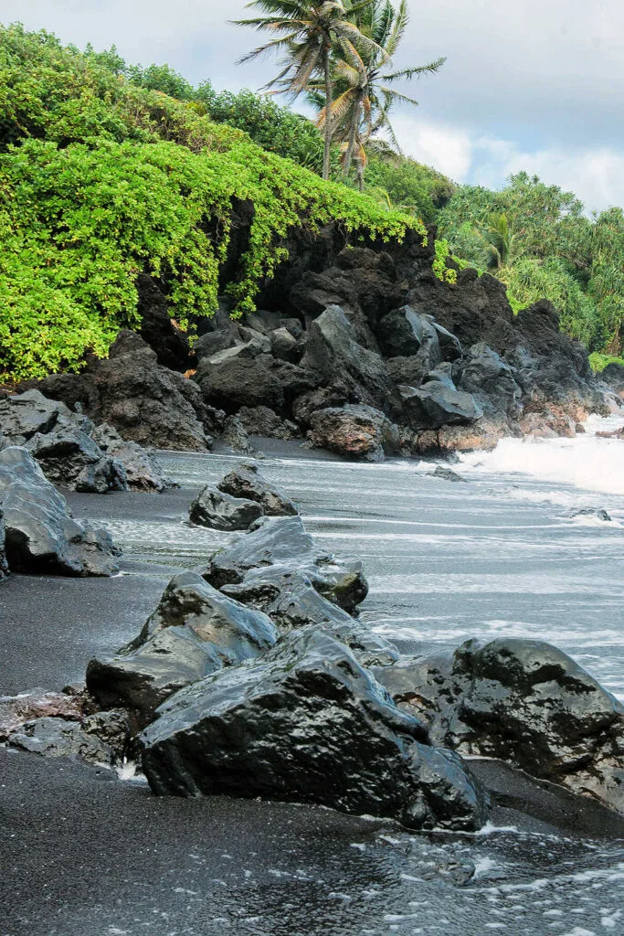 Honokalani Beach, with black sand in Hawaii