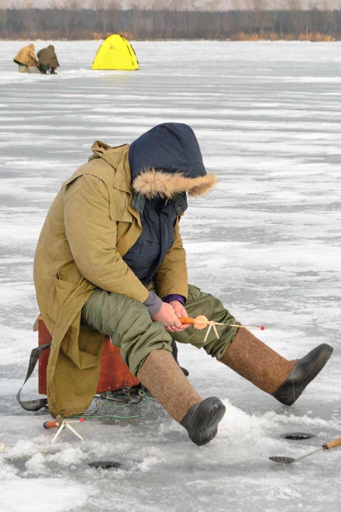 Ice fishing on a frozen lake