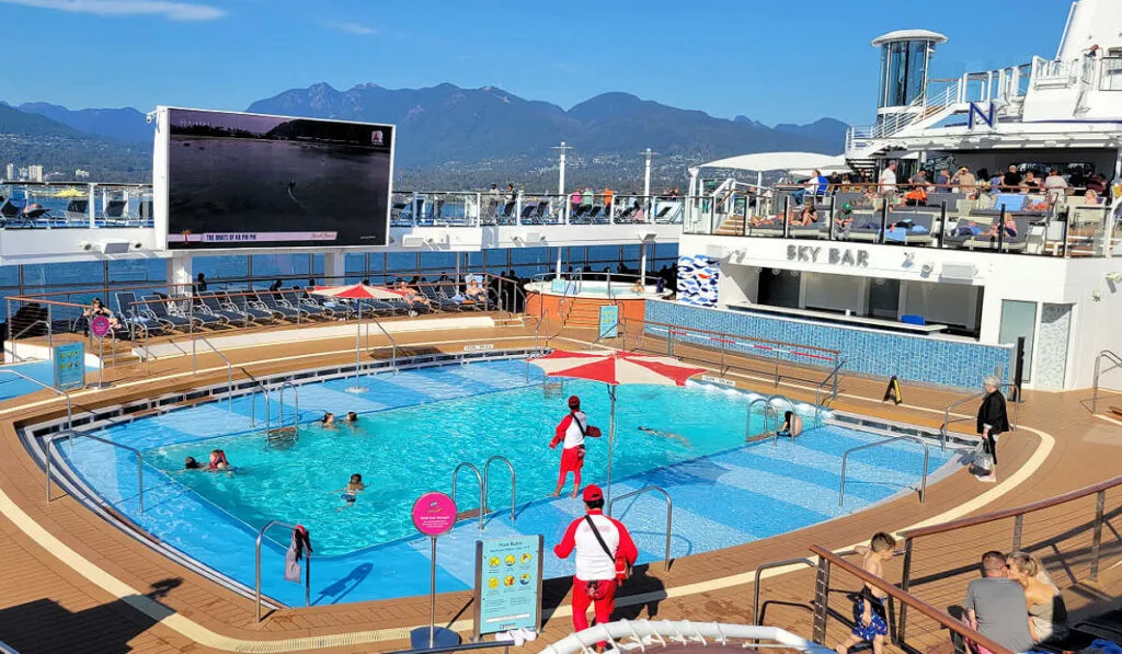 Ovation of the Seas outdoor pool and large TV screen