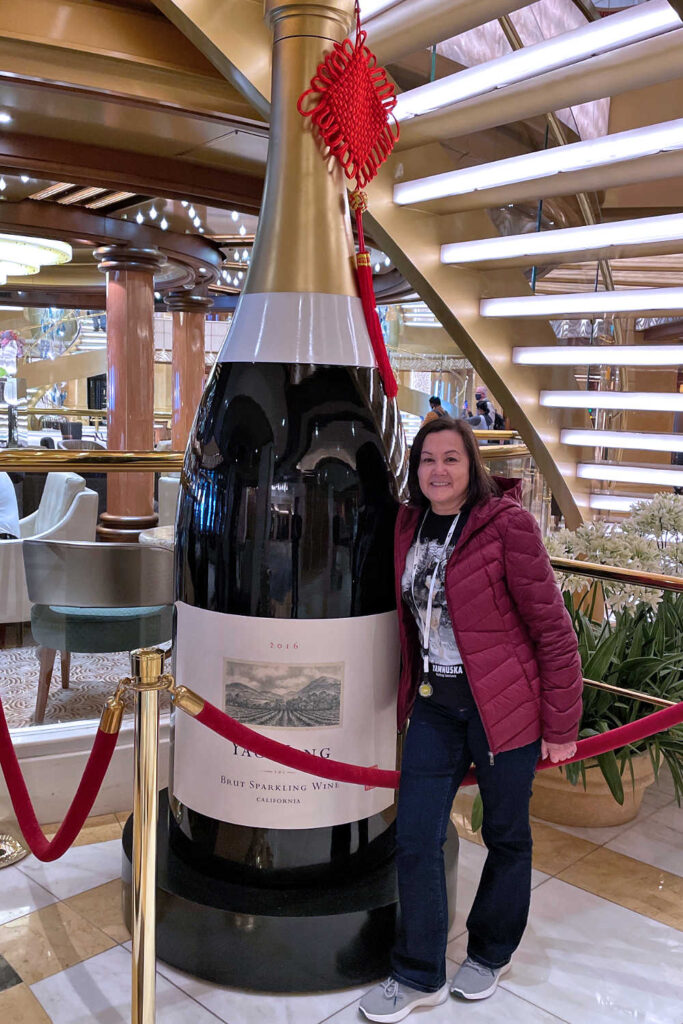 Giant champagne bottle by the International Cafe