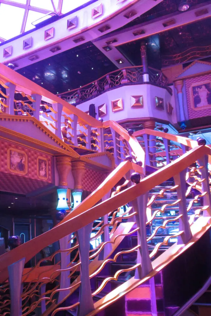 Glass staircase to Nick & Nora's Steakhouse on the Carnival Miracle
