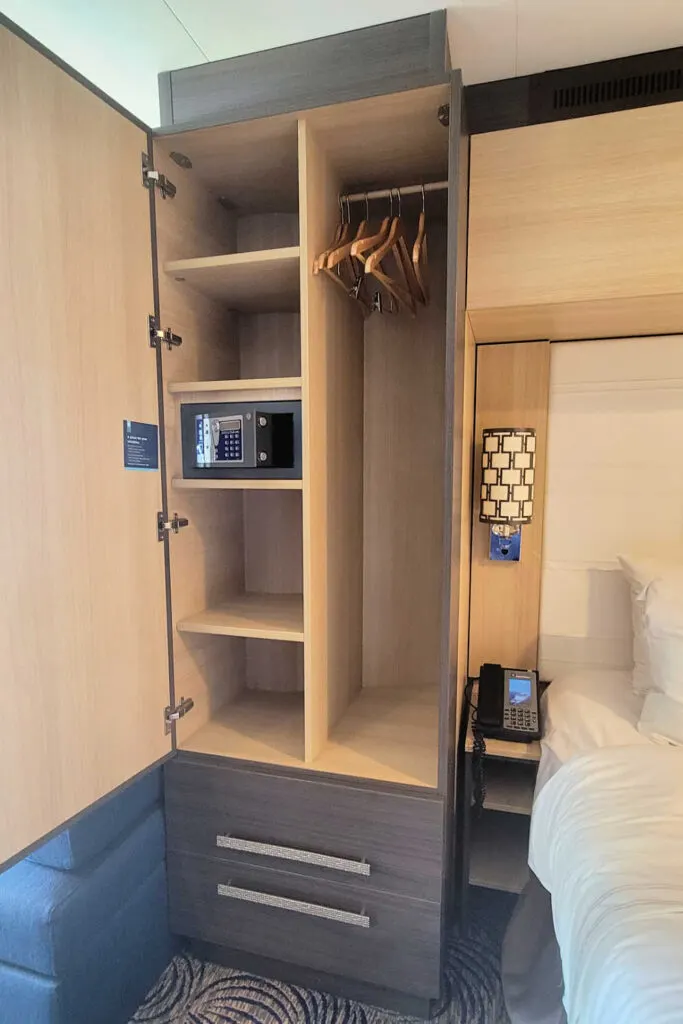 Ovation of the Seas closet with shelves and a safe