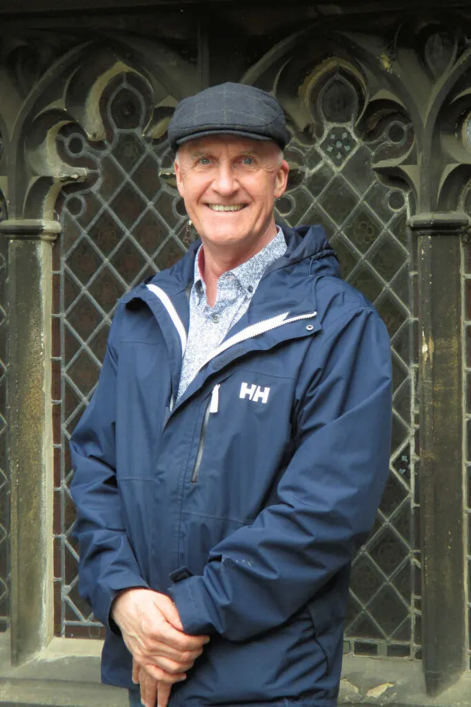 Brian at Gloucester Cathedral in his British flat cap