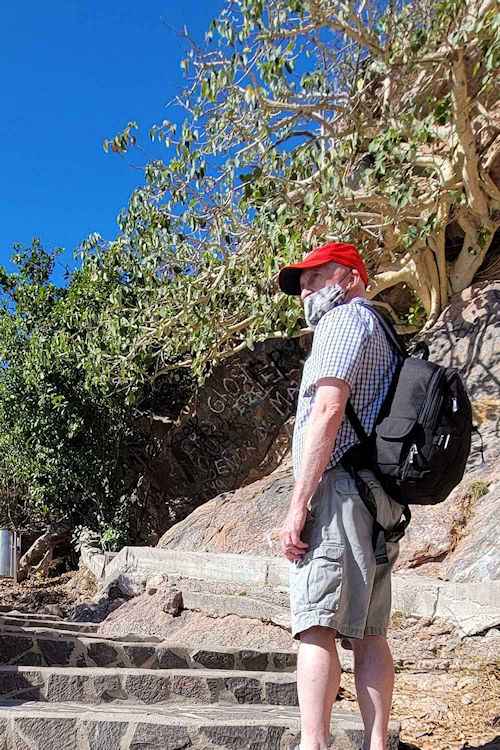 Brian wearing a backpack on the El Faro Lighthouse hike