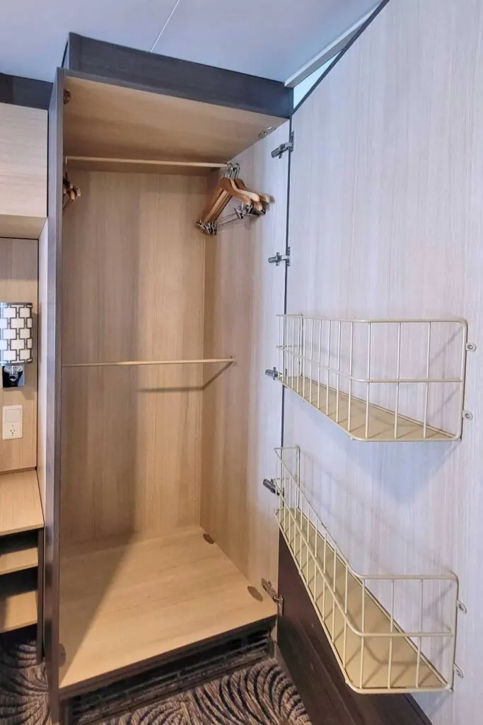 Large stateroom closet with wire baskets