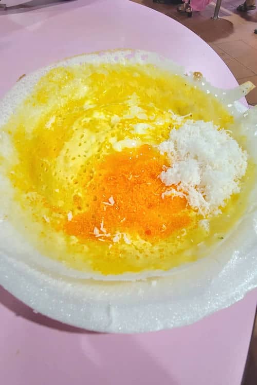 Egg Appam with coconut and orange sugar