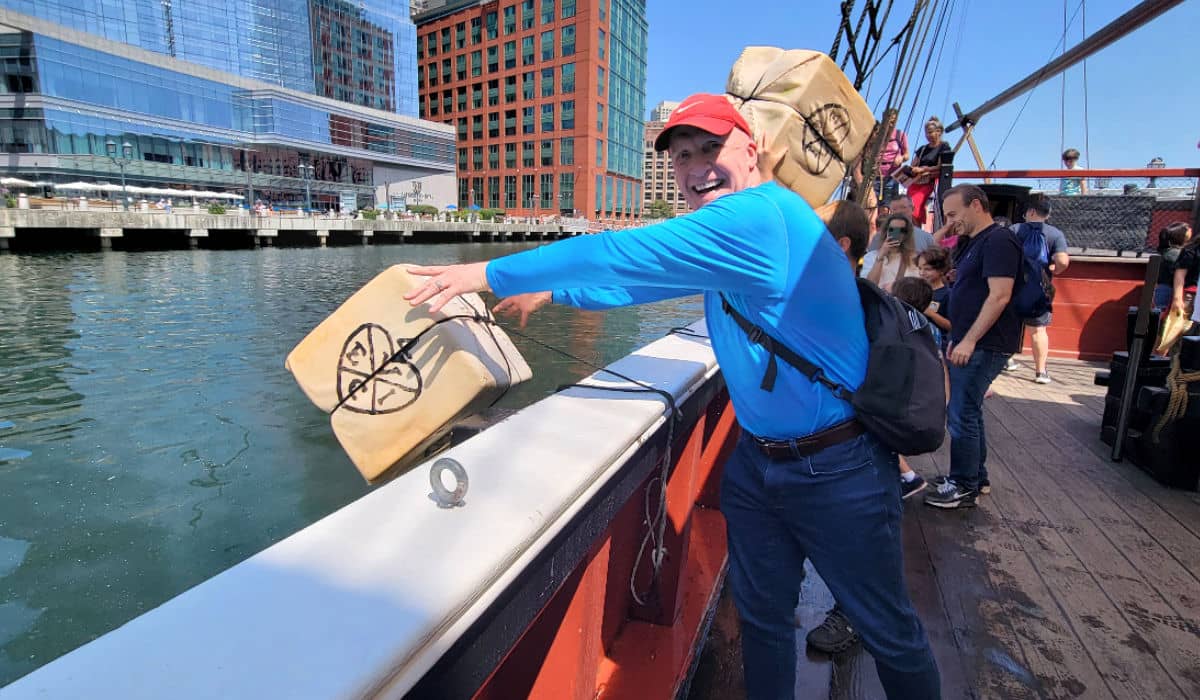 Brian throwing tea into Boston Harbor